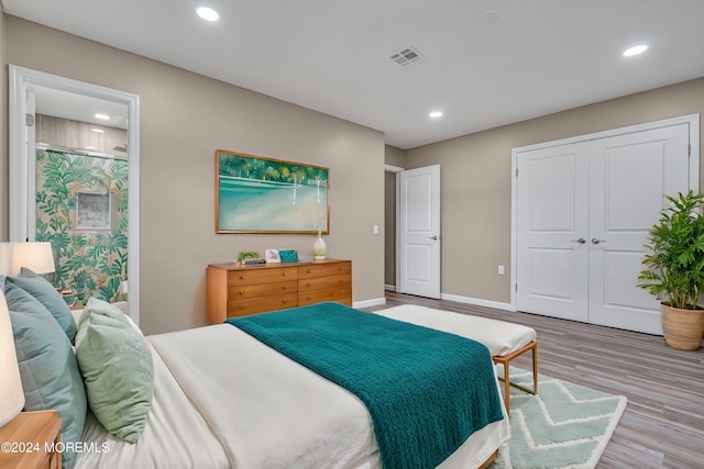 bedroom featuring hardwood / wood-style flooring and a closet