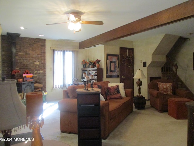 carpeted living room with beam ceiling and ceiling fan