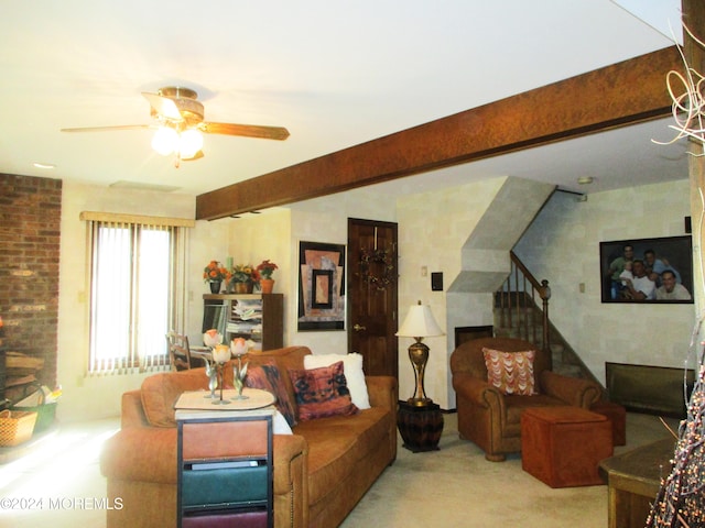 carpeted living room with beam ceiling and ceiling fan