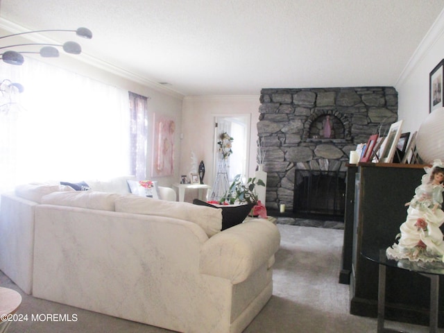 living room with a textured ceiling, carpet, a stone fireplace, and crown molding