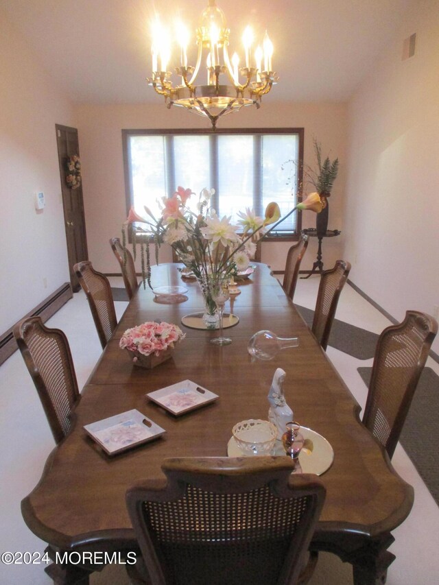 dining space featuring a notable chandelier