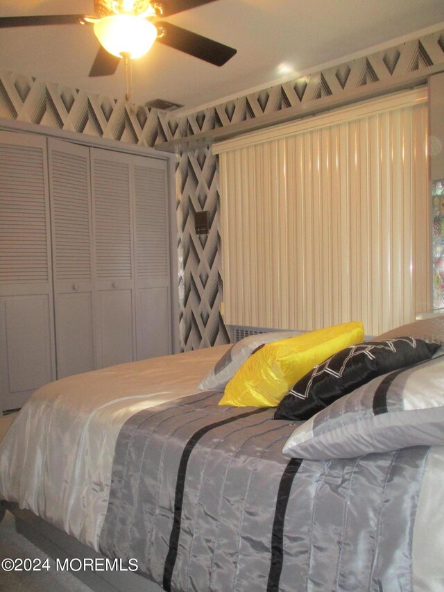 bedroom featuring a closet and ceiling fan