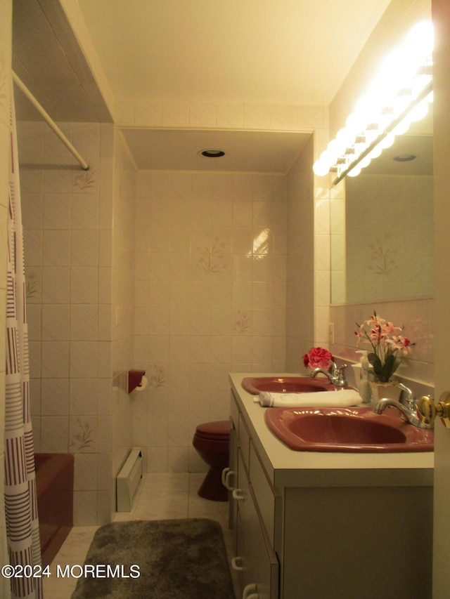 bathroom with vanity, walk in shower, a baseboard radiator, tile walls, and toilet