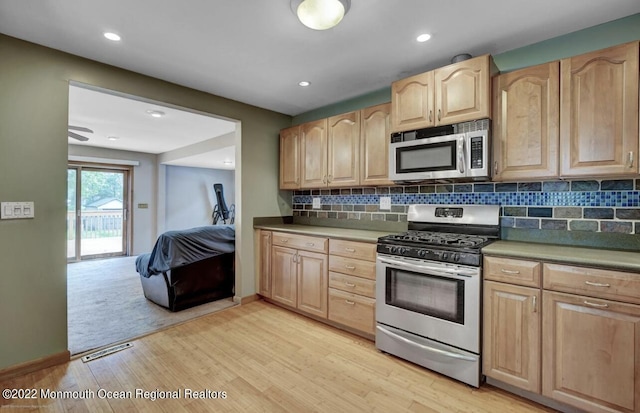 kitchen with visible vents, appliances with stainless steel finishes, light wood-style flooring, and light brown cabinetry