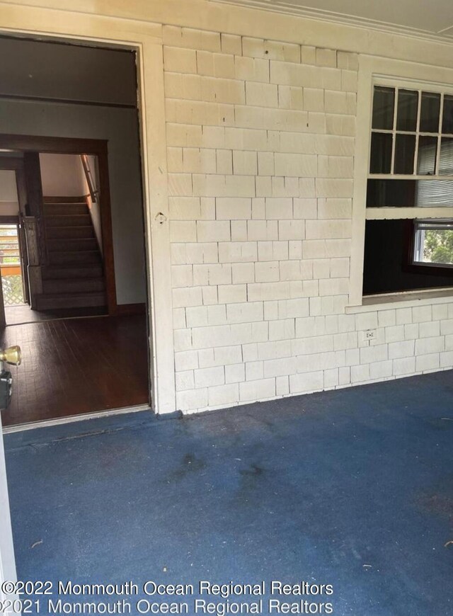 room details featuring concrete floors and ornamental molding