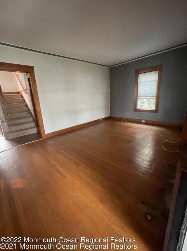 empty room featuring wood-type flooring