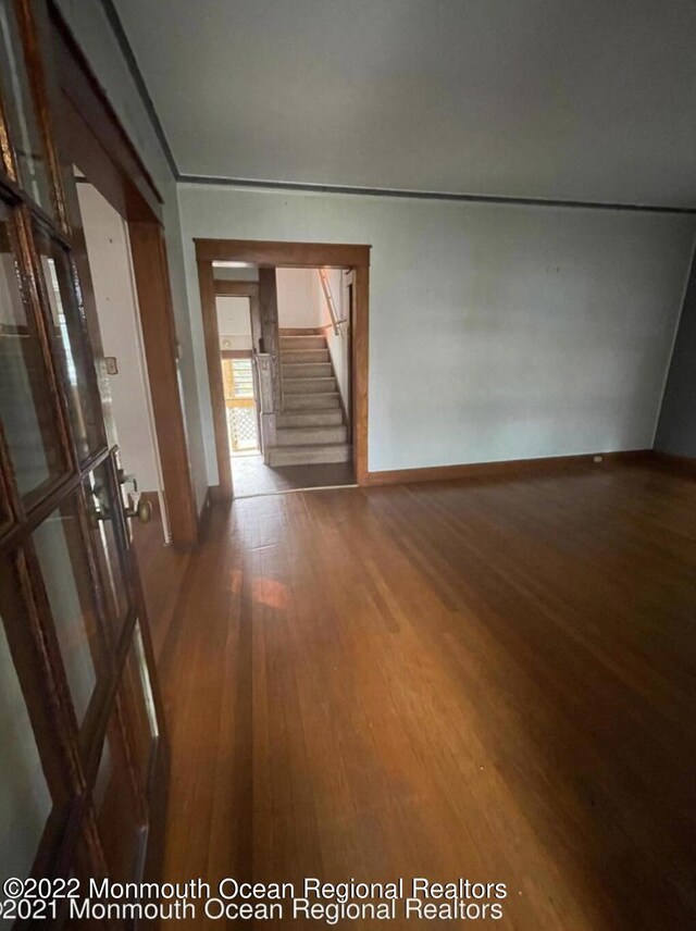 corridor featuring wood-type flooring