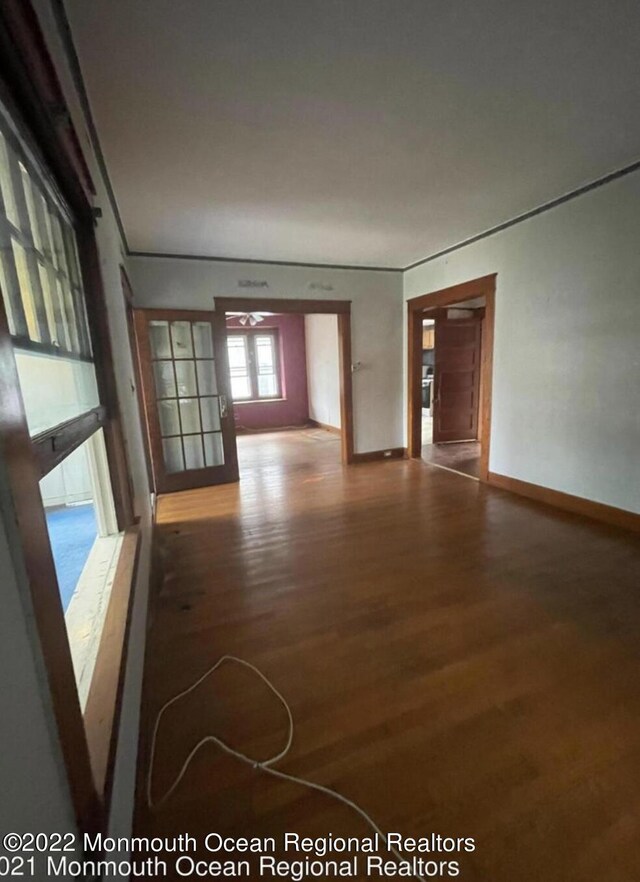 empty room with hardwood / wood-style flooring