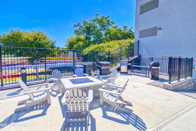 view of patio / terrace with an outdoor fire pit