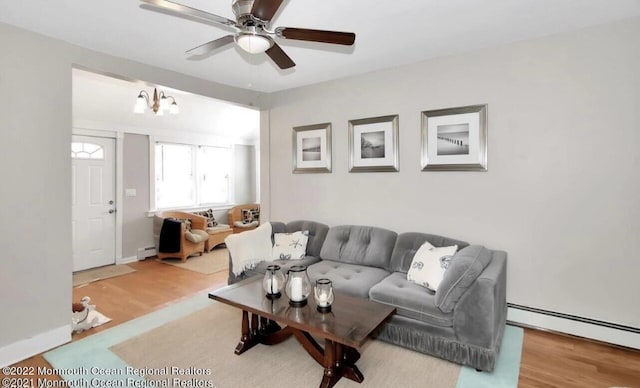 52 Liberty St, Long Branch, NJ 07740 - living room featuring a baseboard radiator, wood finished floors, and ceiling fan