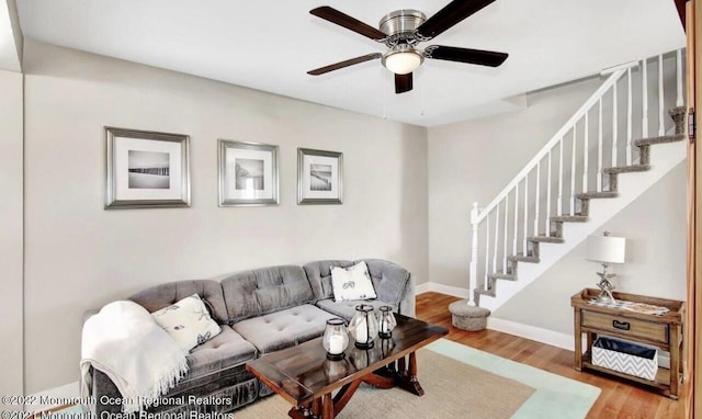 52 Liberty St, Long Branch, NJ 07740 - living area with stairway, ceiling fan, wood finished floors, and baseboards
