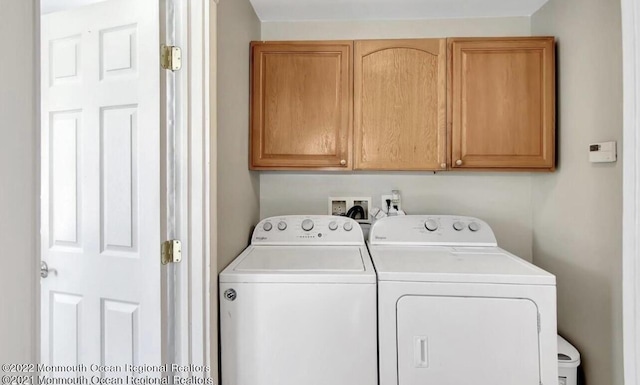 52 Liberty St, Long Branch, NJ 07740 - laundry area featuring separate washer and dryer and cabinet space