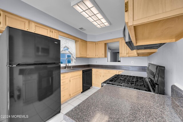 kitchen with black appliances, light tile patterned flooring, sink, and light brown cabinets