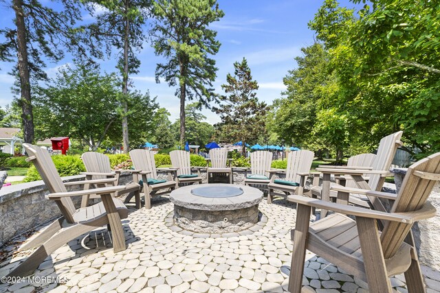 view of patio with an outdoor fire pit