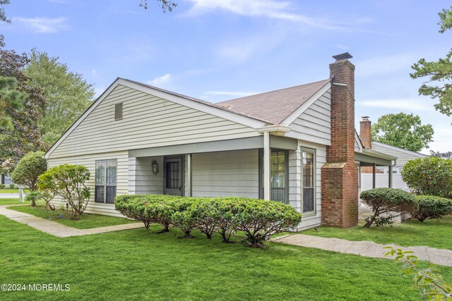 view of front of home with a front yard