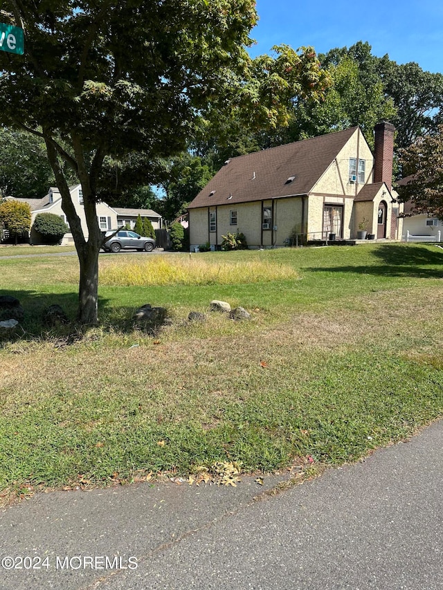 view of front of home with a front yard