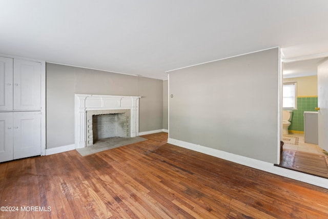 unfurnished living room featuring hardwood / wood-style floors