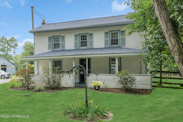 view of front of property featuring a porch and a front lawn