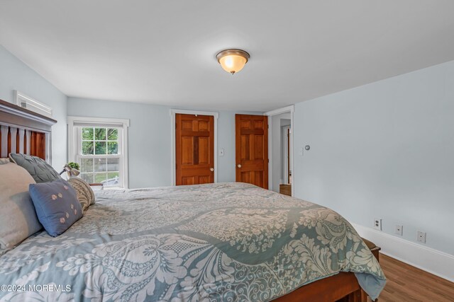 bedroom with hardwood / wood-style floors