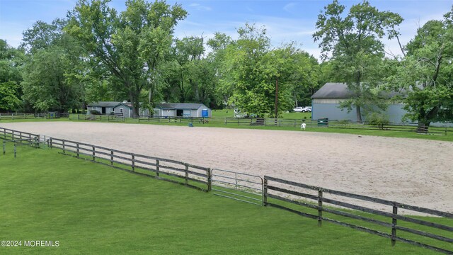 surrounding community with a lawn and a rural view