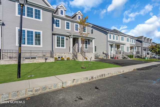 view of property featuring a front yard