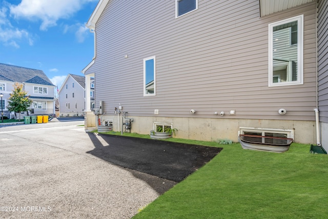 rear view of property with a yard and a patio