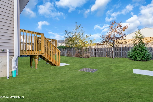 view of yard featuring a wooden deck