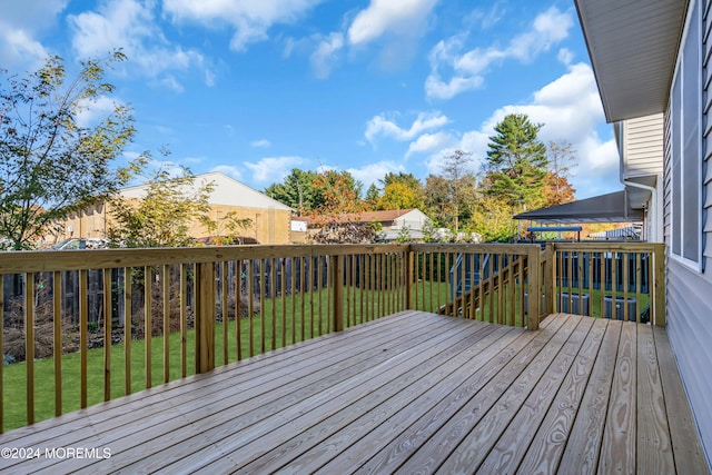 deck featuring a lawn