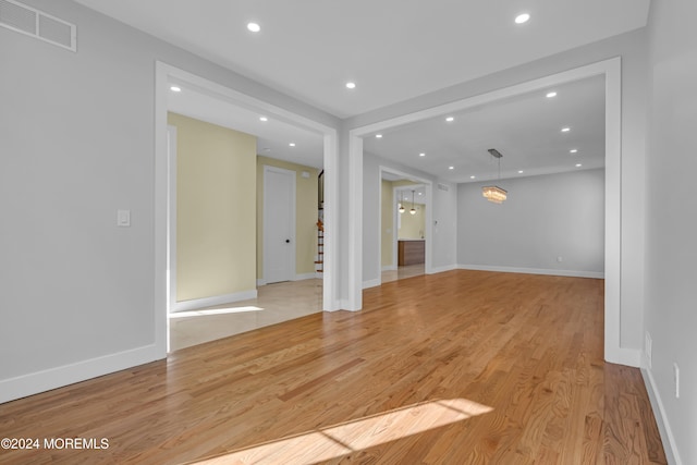 unfurnished living room with light wood-type flooring