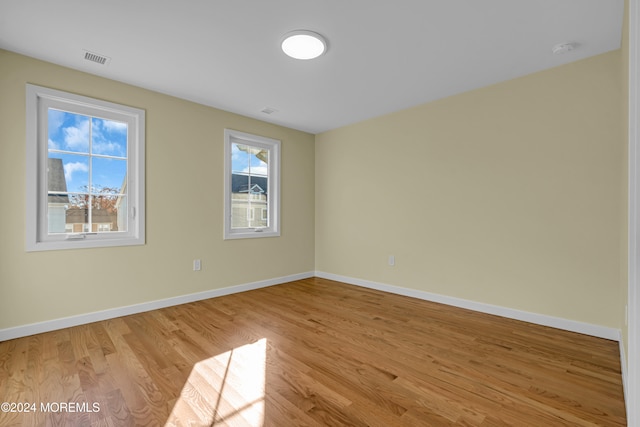 unfurnished room featuring light hardwood / wood-style floors