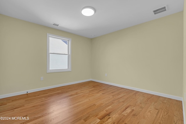 spare room with light hardwood / wood-style floors