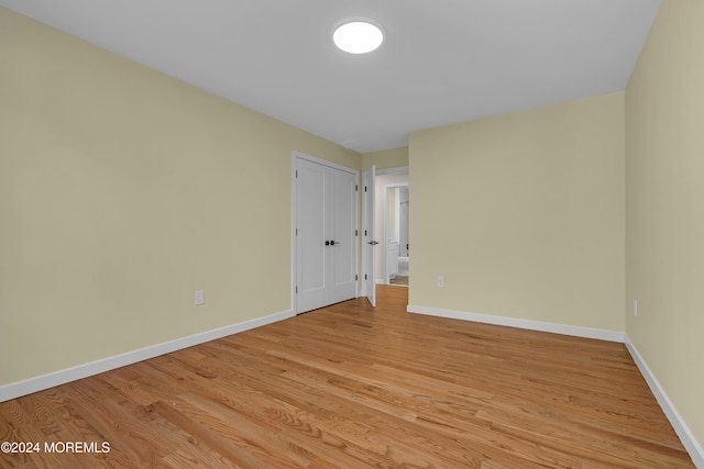 unfurnished room featuring light wood-type flooring