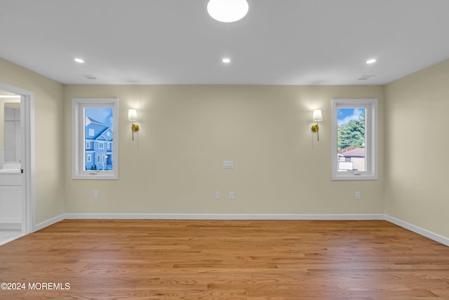 spare room featuring light wood-type flooring