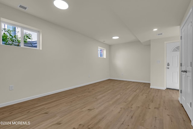 unfurnished room with light wood-type flooring and a healthy amount of sunlight