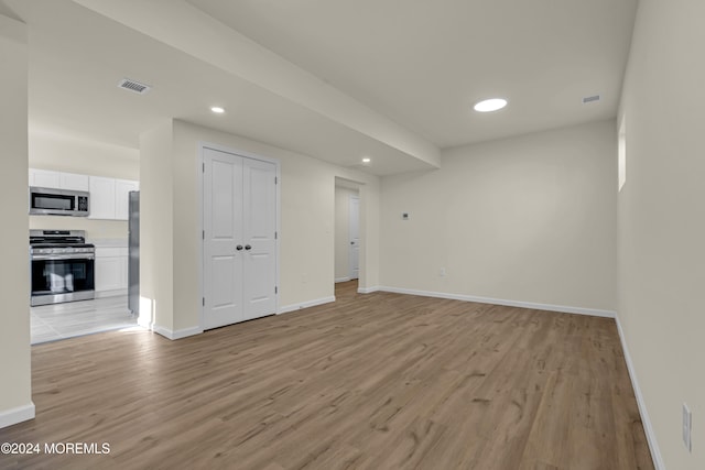 spare room featuring light hardwood / wood-style floors