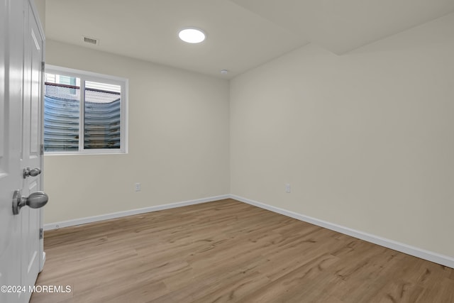 spare room with light hardwood / wood-style floors