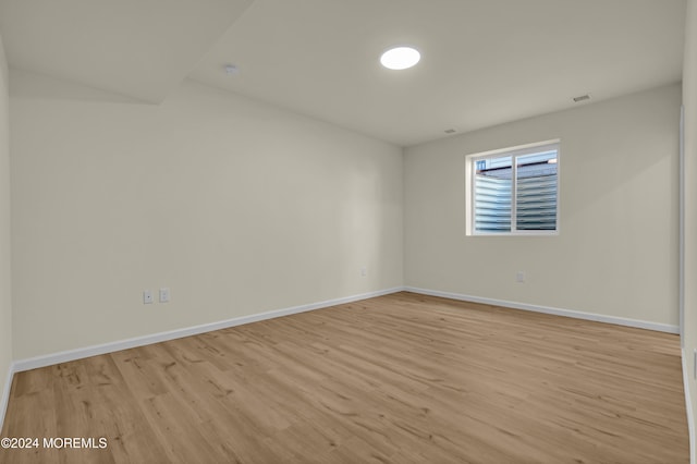 spare room featuring light hardwood / wood-style floors