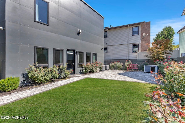 exterior space with a patio area and central air condition unit