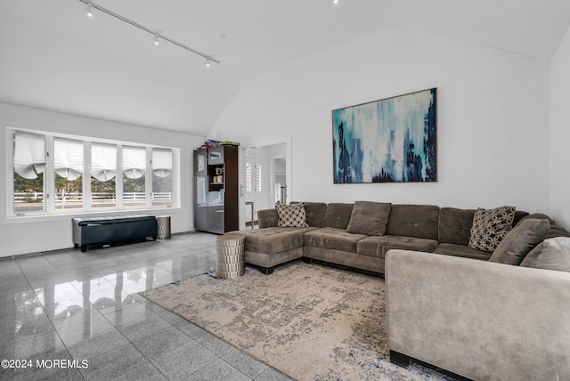 living room with track lighting and high vaulted ceiling