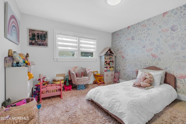 bedroom featuring hardwood / wood-style flooring