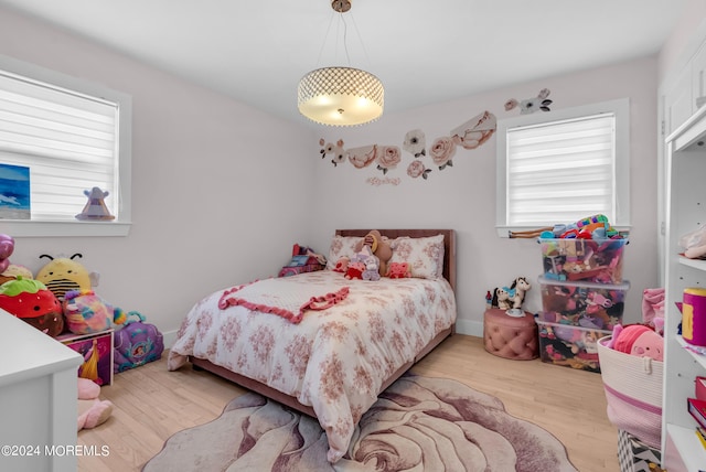 bedroom with light hardwood / wood-style flooring