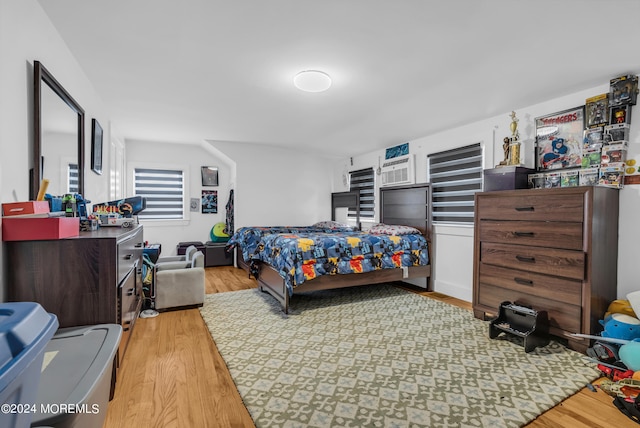 bedroom with light hardwood / wood-style flooring