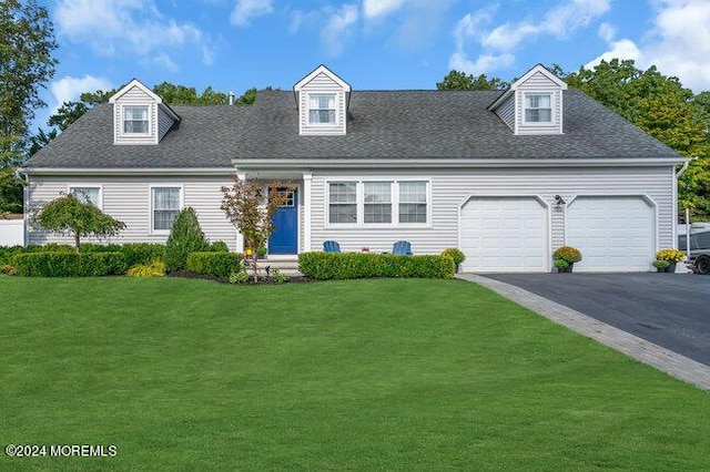 cape cod home featuring driveway, a shingled roof, a garage, and a front yard