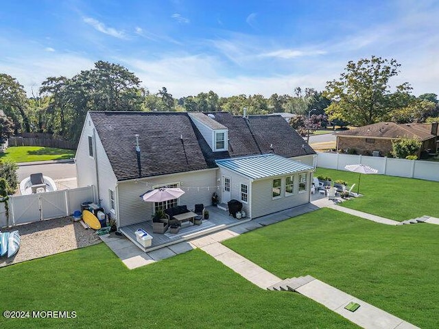 back of property featuring a yard, a gate, a patio area, a deck, and a fenced backyard