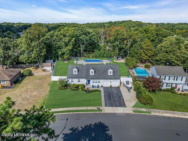 drone / aerial view with a view of trees