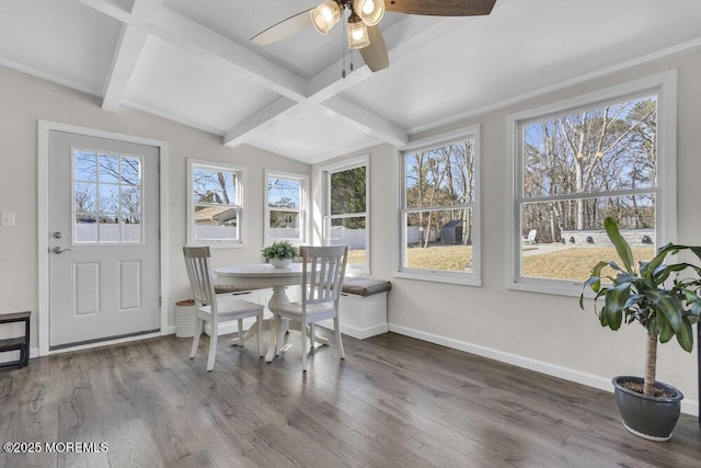 sunroom / solarium featuring vaulted ceiling with beams, ceiling fan, and a wealth of natural light