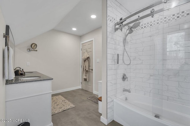 bathroom featuring baseboards, lofted ceiling, vanity, shower / washtub combination, and recessed lighting