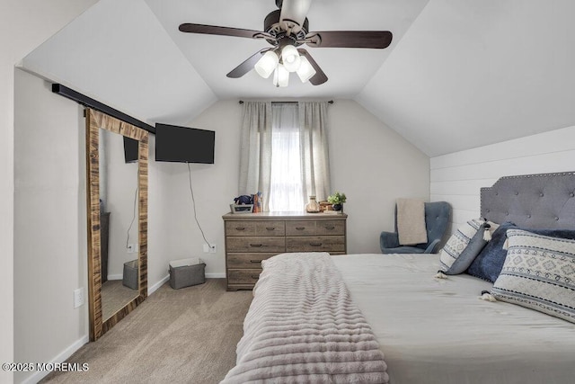 bedroom featuring lofted ceiling, light colored carpet, ceiling fan, and baseboards