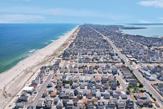 aerial overview of property's location with unending shoreline and nearby suburban area