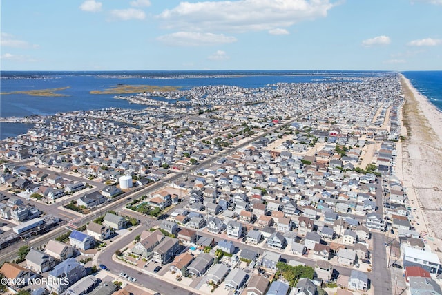 aerial view of property's location with a nearby body of water